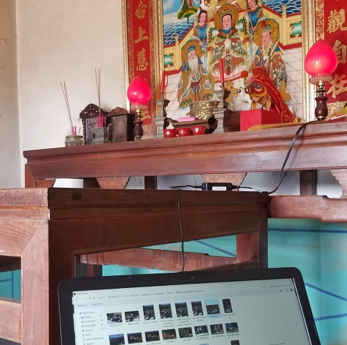 digital nomad remote worker working in an Asian altar